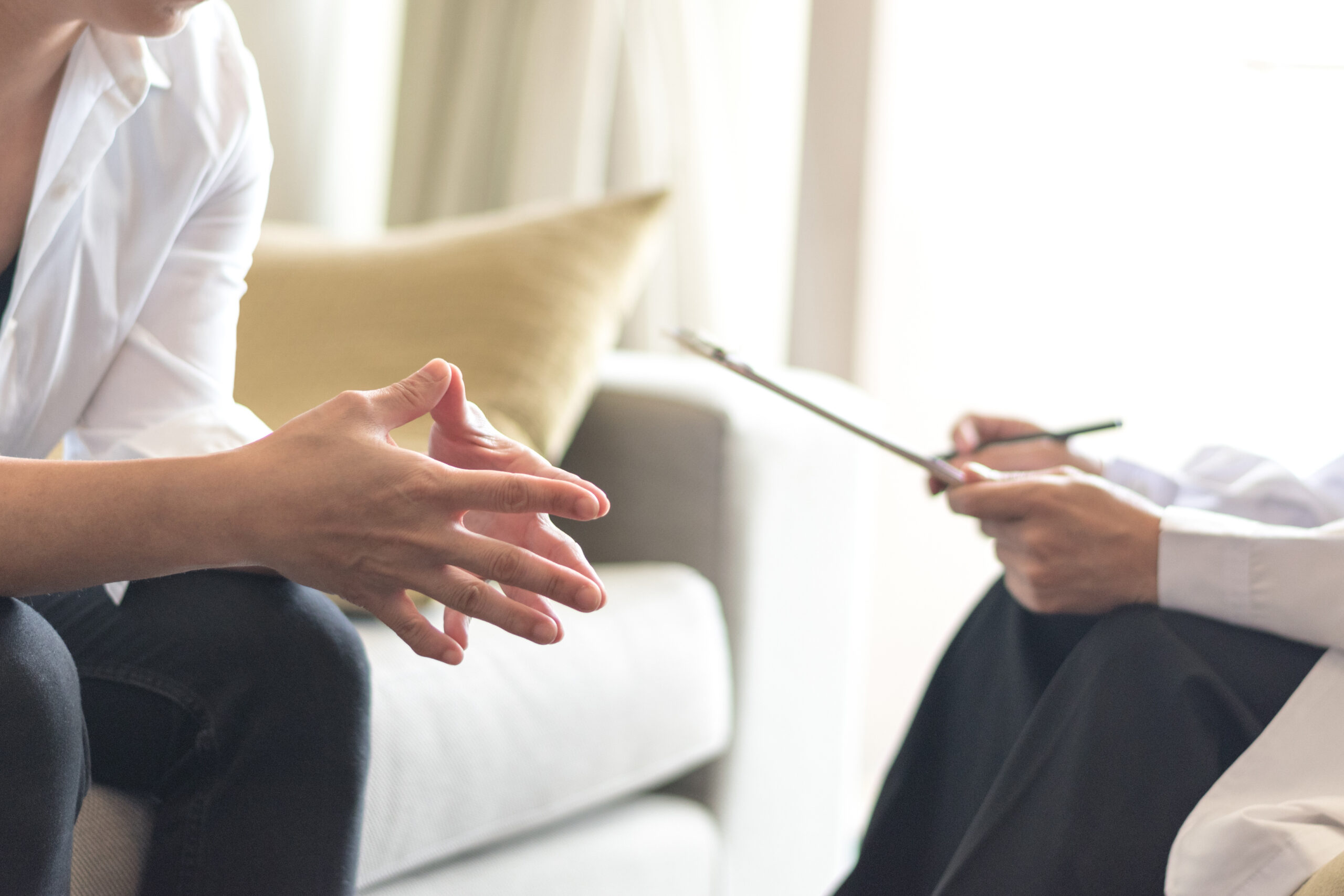 Patient speaking with therapist during ketamine therapy consultation at Better Health Whole Wellness Center Philadelphia