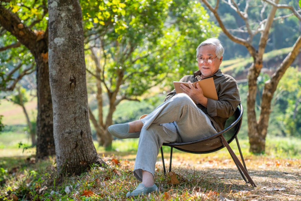 Older adult man sitting peacefully outdoors representing relief from late-life depression after ketamine therapy in Philadelphia